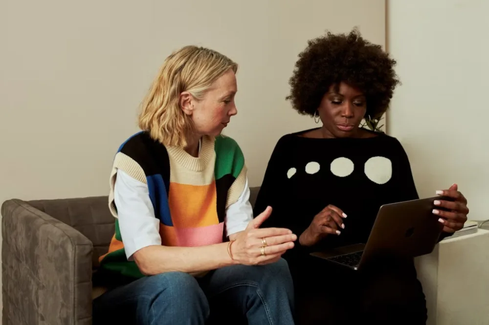 Life coach working with a client online